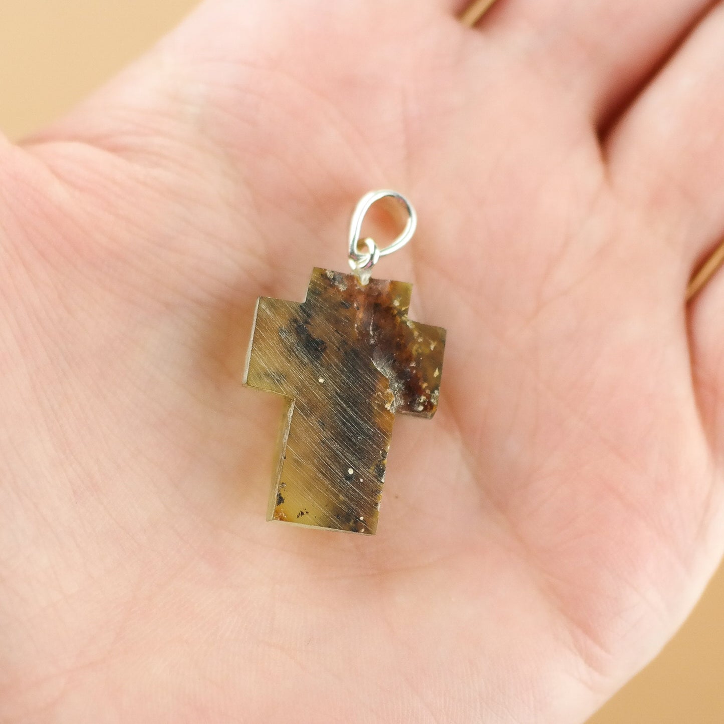 Raw amber cross pendant