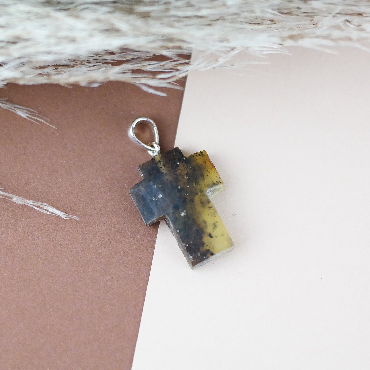 Raw amber cross pendant