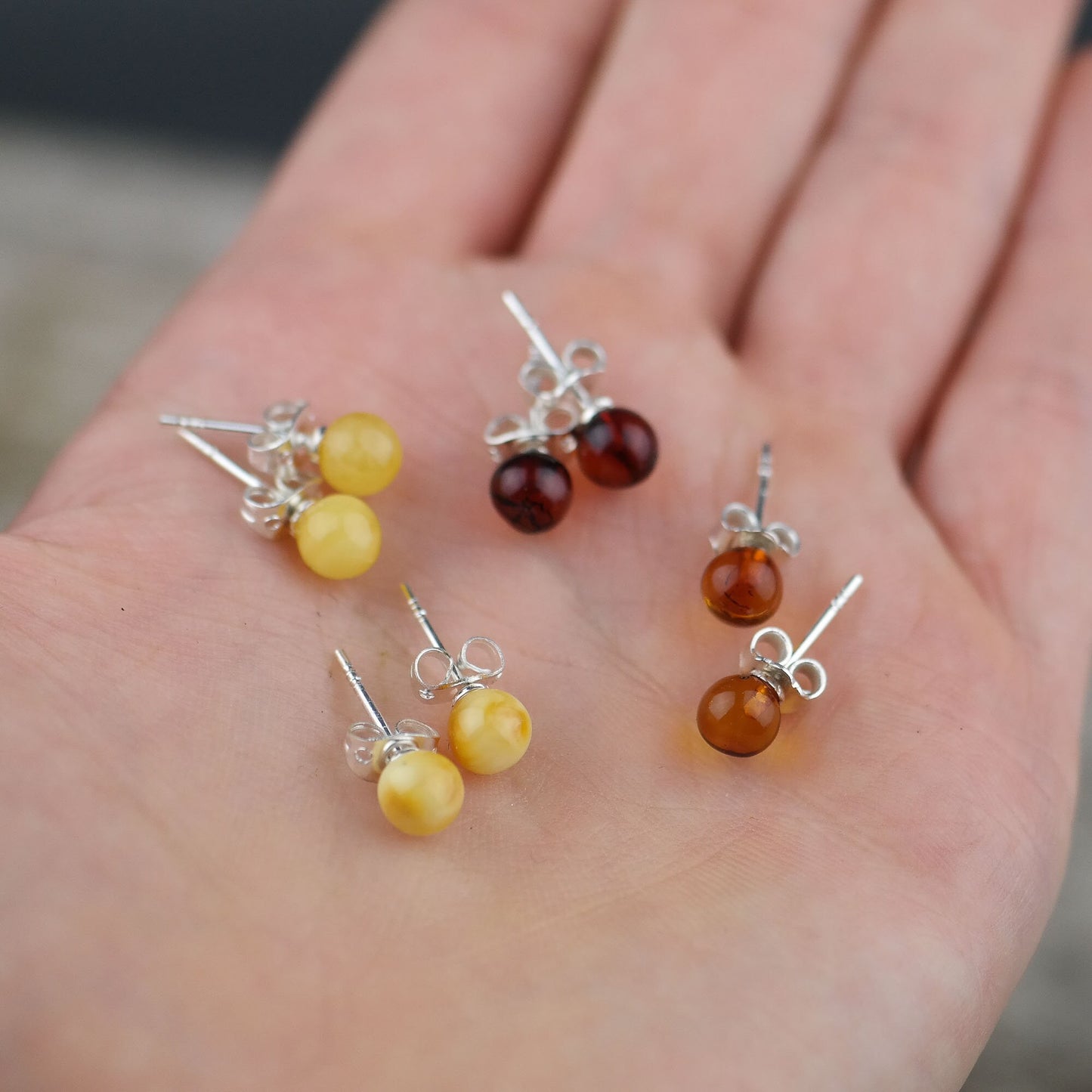 Stud earrings from natural Baltic amber beads