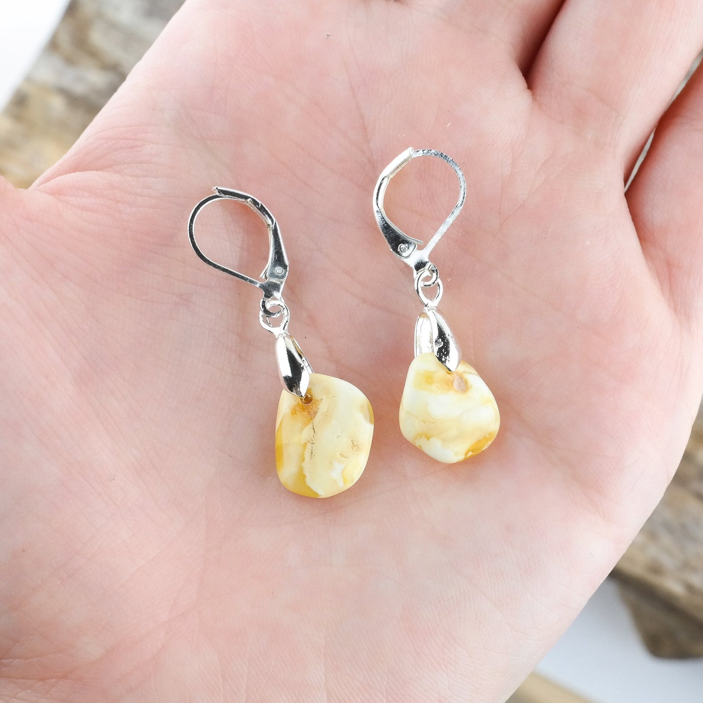 Earrings with natural amber beads