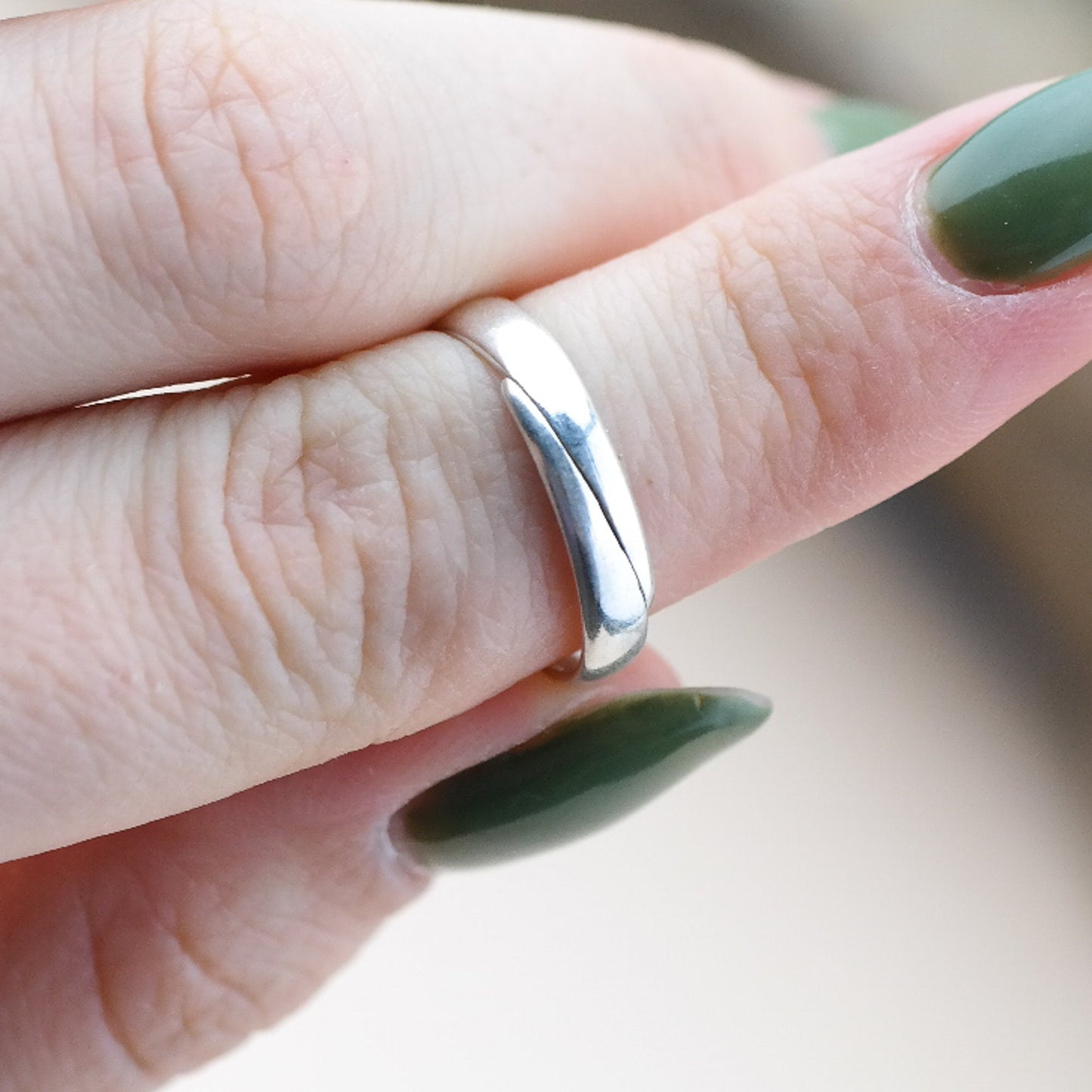 Adjustable silver ring with natural amber bead