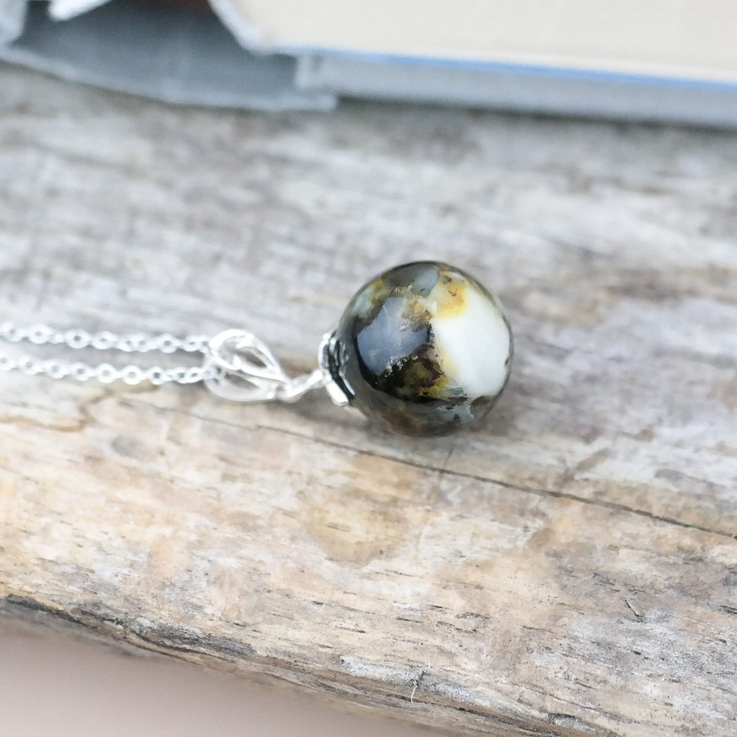 Silver round amber pendant