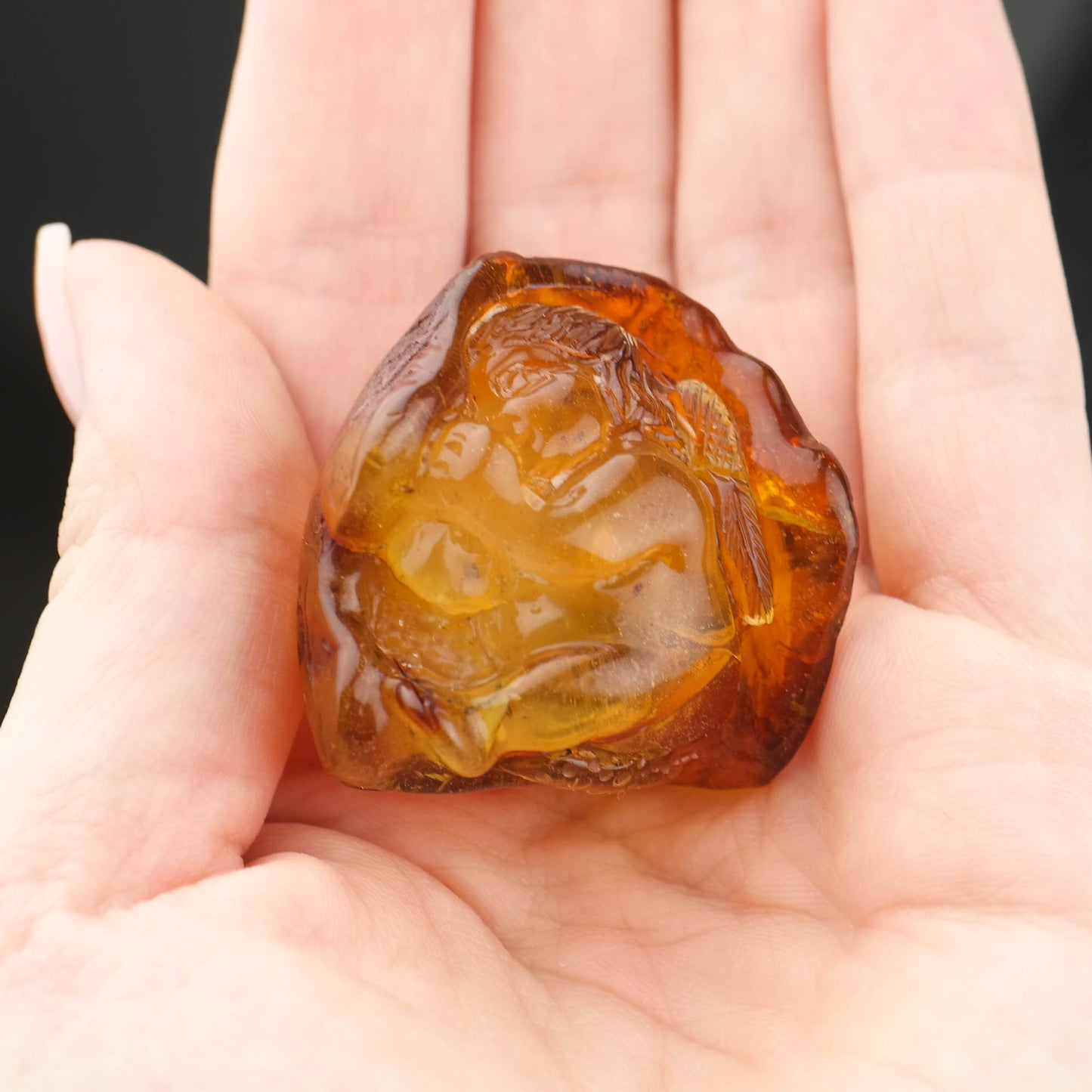 Hand carved baby figurine from natural Baltic amber