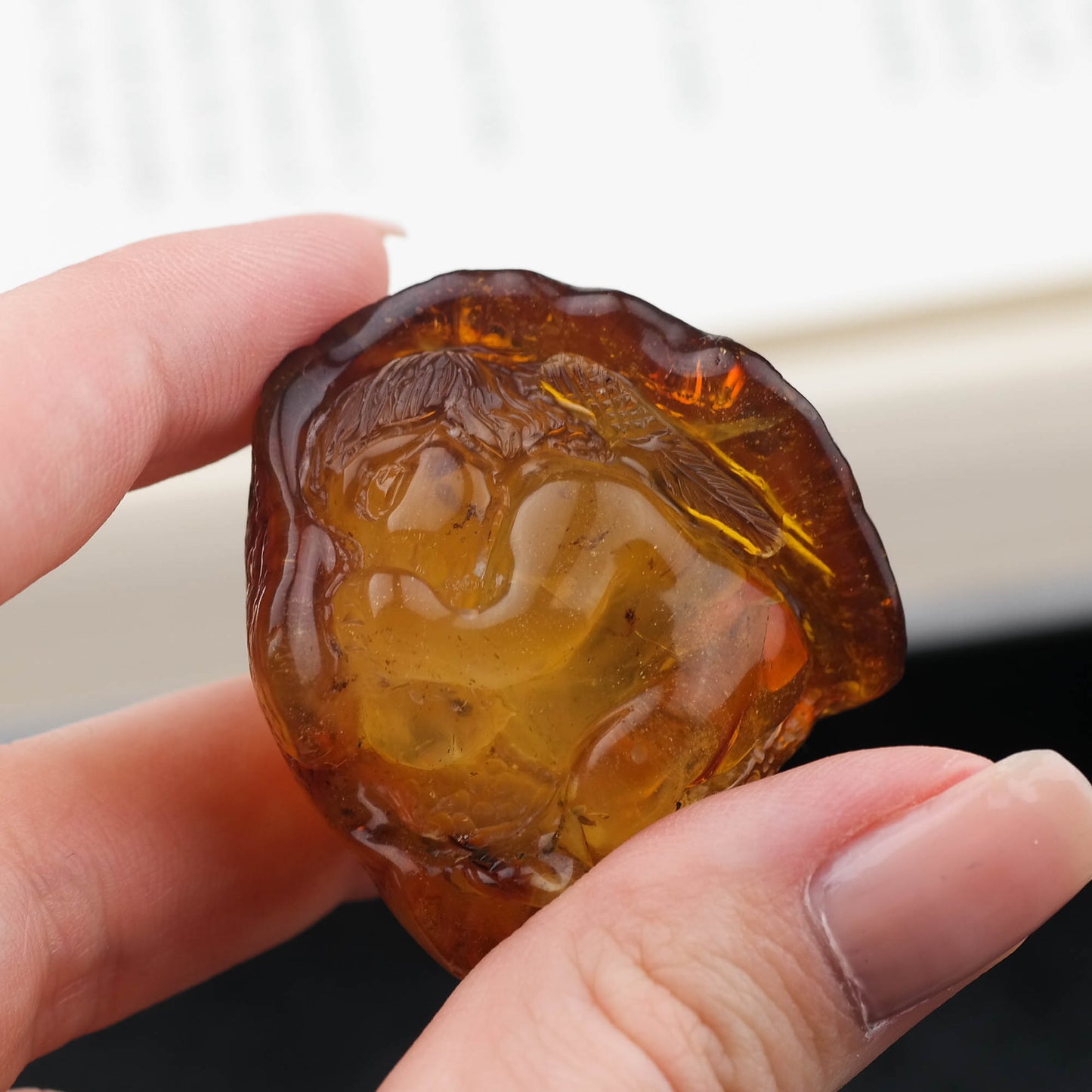 Hand carved baby figurine from natural Baltic amber