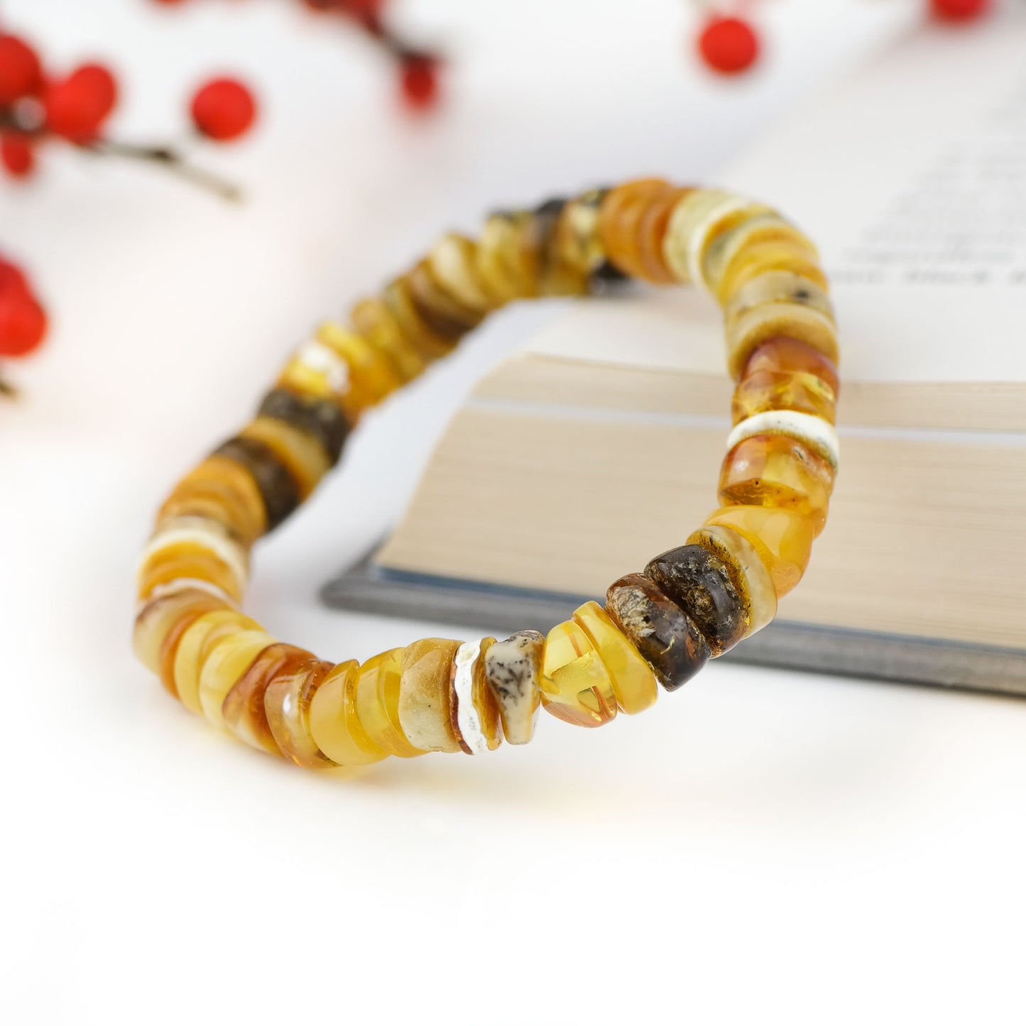 Colourful bracelet from tube shaped amber beads