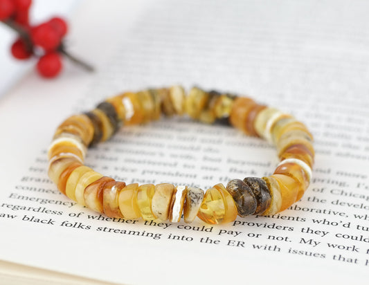 Colourful bracelet from tube shaped amber beads