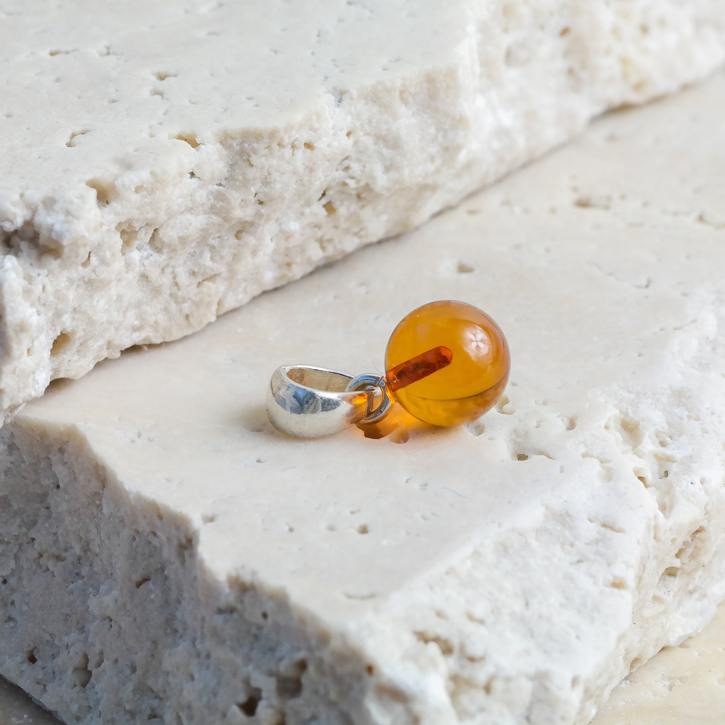 Chic and tiny natural Baltic amber ball pendant