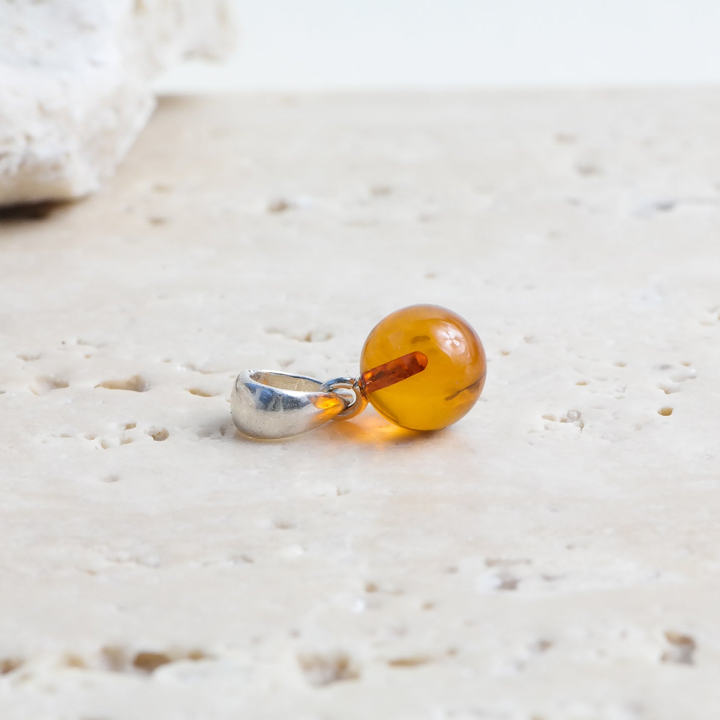 Chic and tiny natural Baltic amber ball pendant