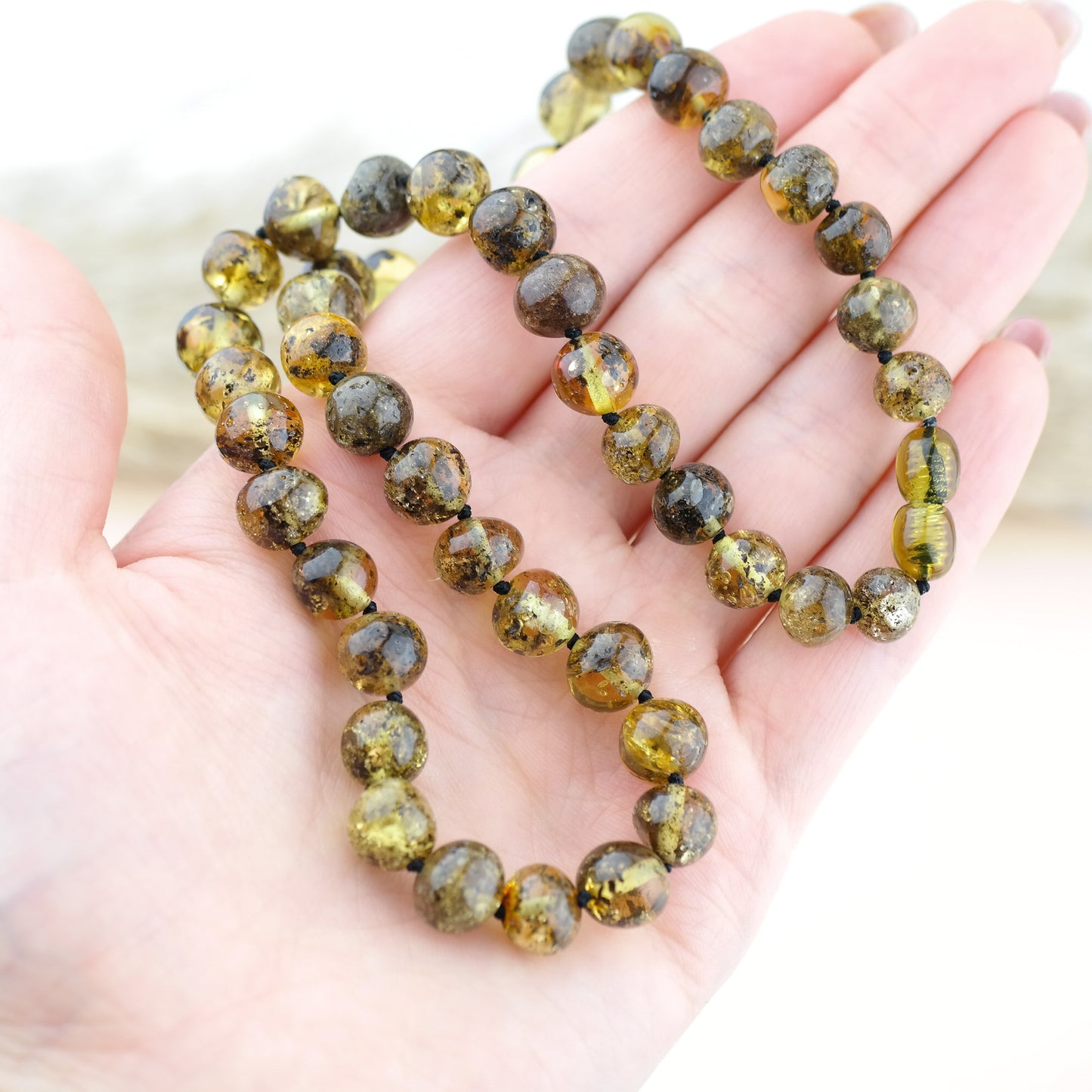 Green amber necklace from large baroque beads