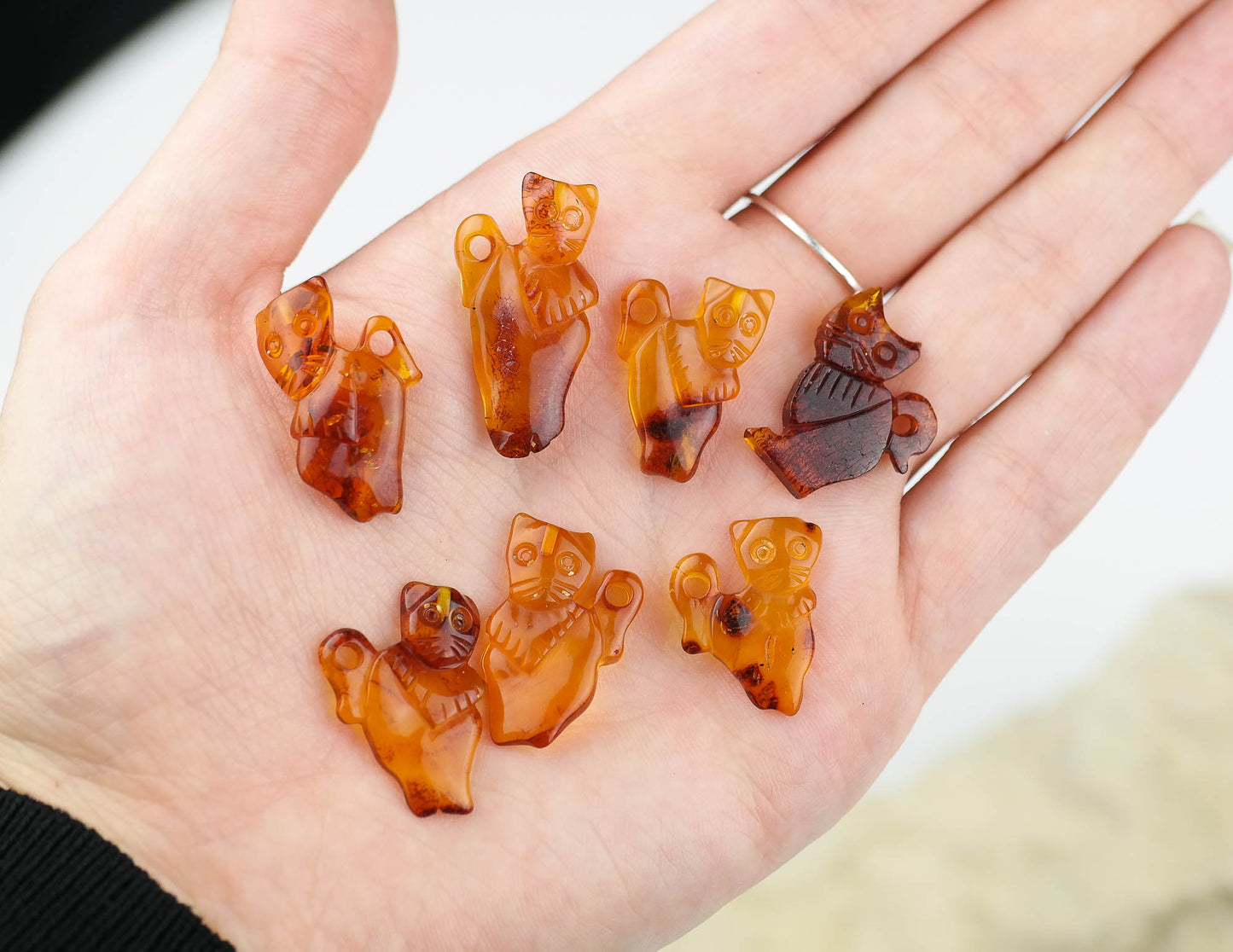 Tiny hand carved kitten figurines from natural Baltic amber