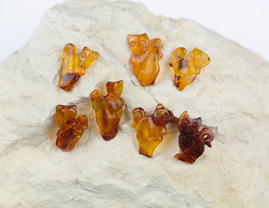 Tiny hand carved kitten figurines from natural Baltic amber