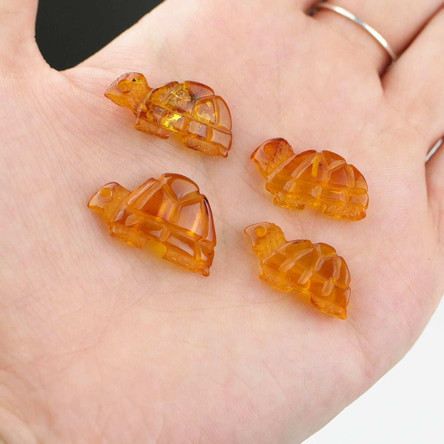 Tiny turtle figurines from natural Baltic amber