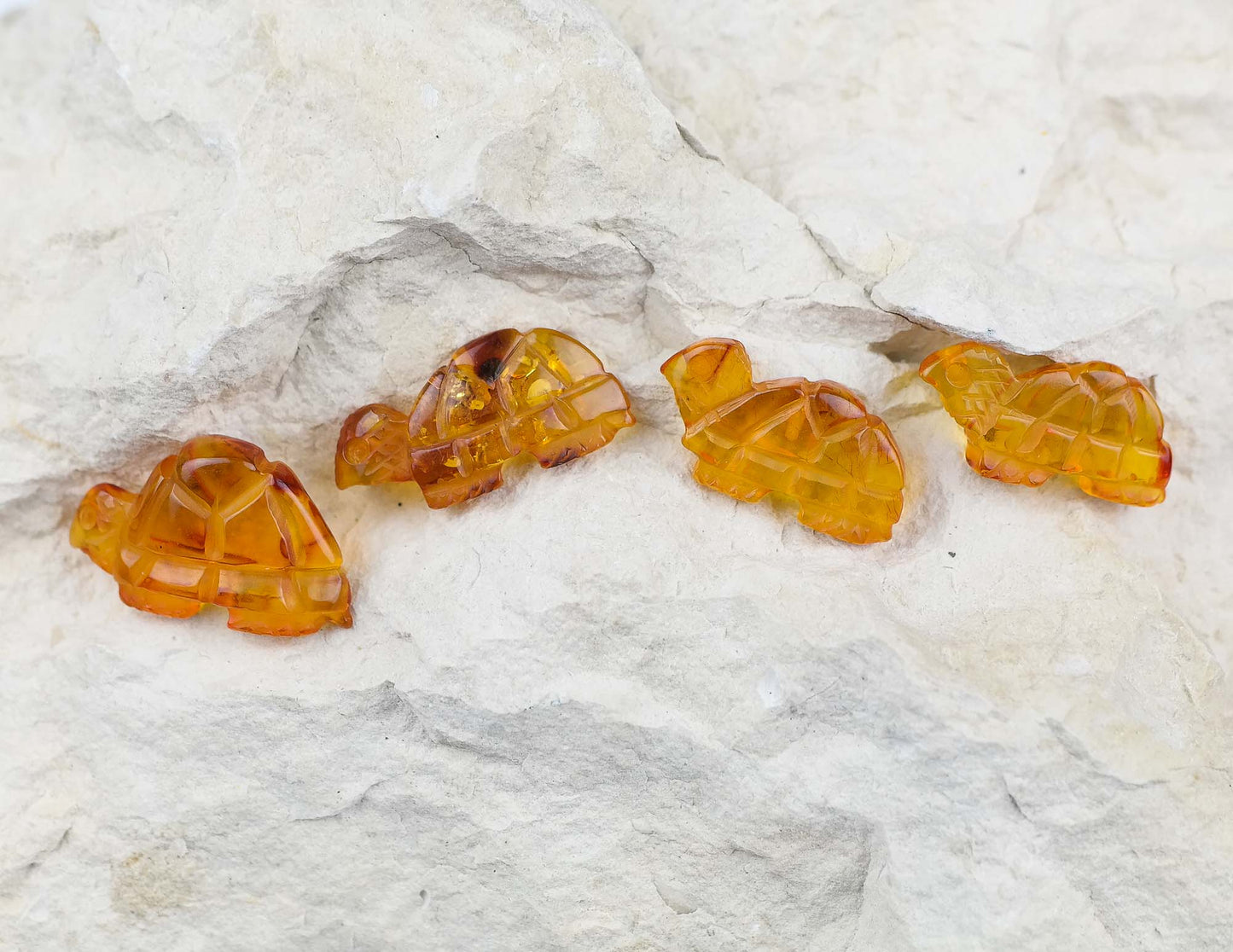 Tiny turtle figurines from natural Baltic amber