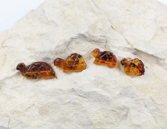 Cute turtle figurines from natural Baltic amber