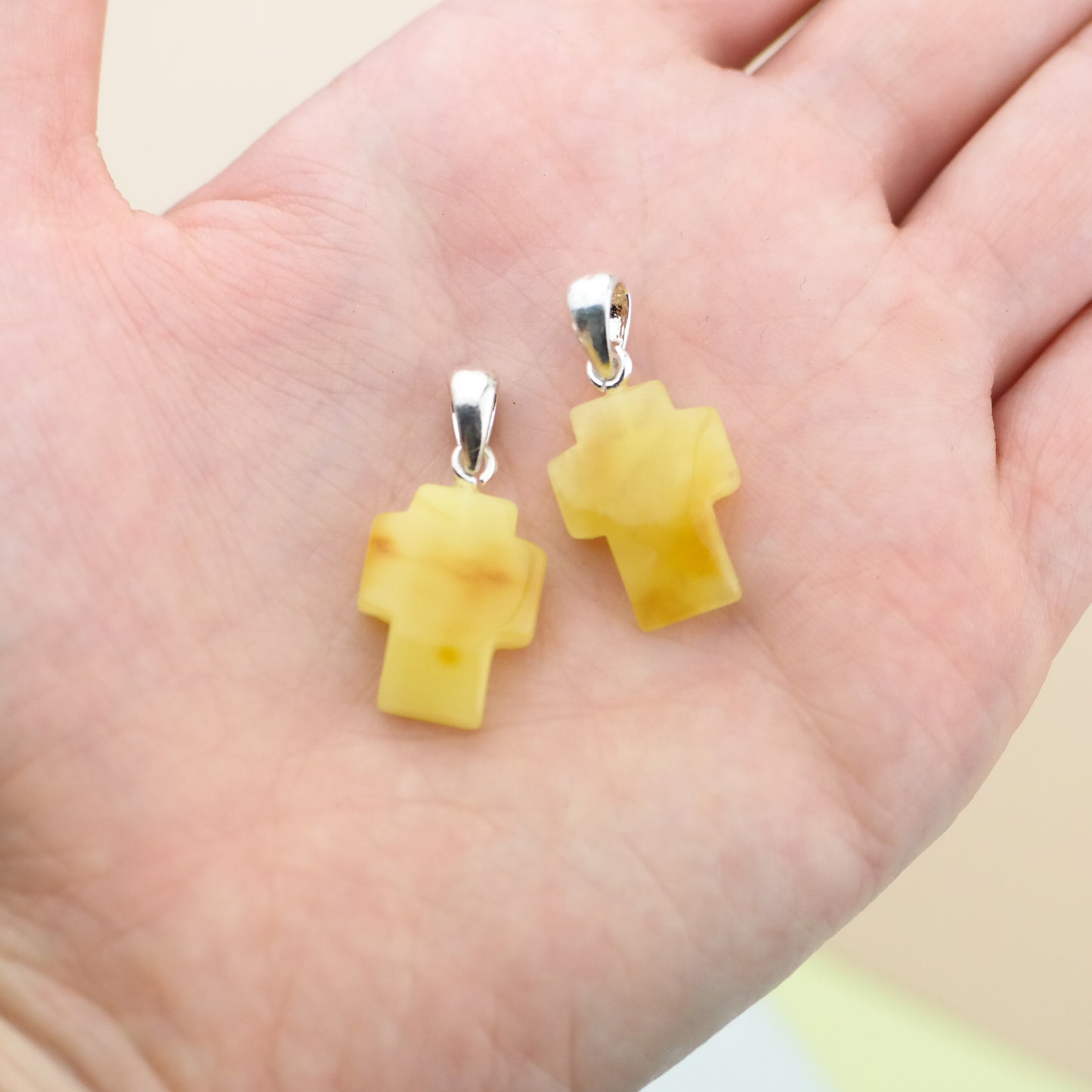 Butterscotch cross pendants for couple