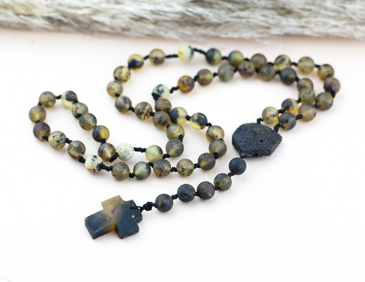 Baltic amber rosary made of green, baroque shaped amber beads