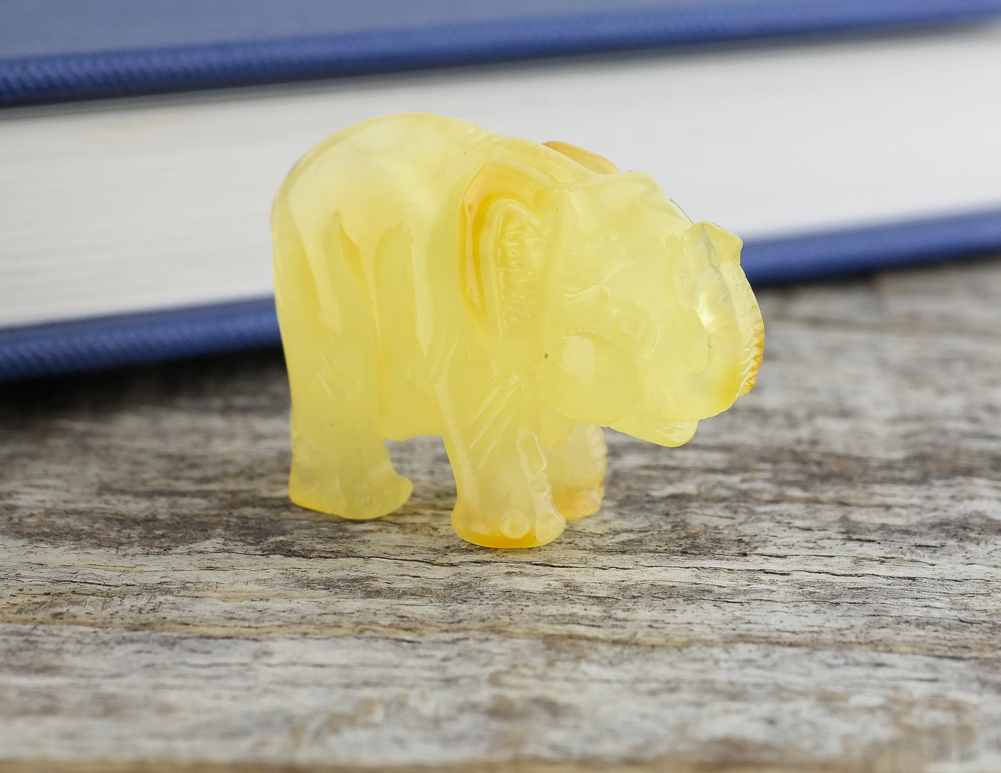 Hand carved natural Baltic amber elephant figurine perfect as a housewarming gift