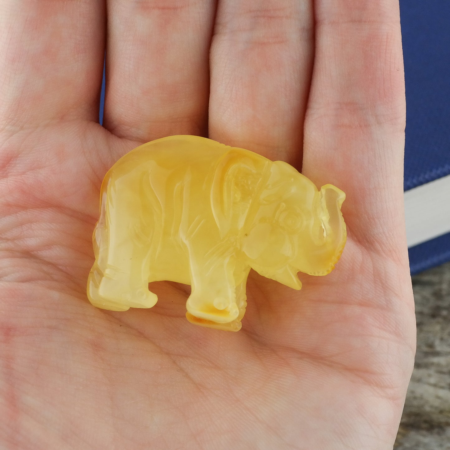 Hand carved natural Baltic amber elephant figurine perfect as a housewarming gift