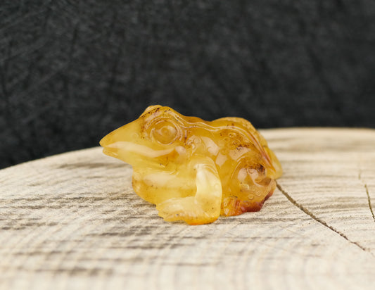 Hand carved frog figurine from natural Baltic amber