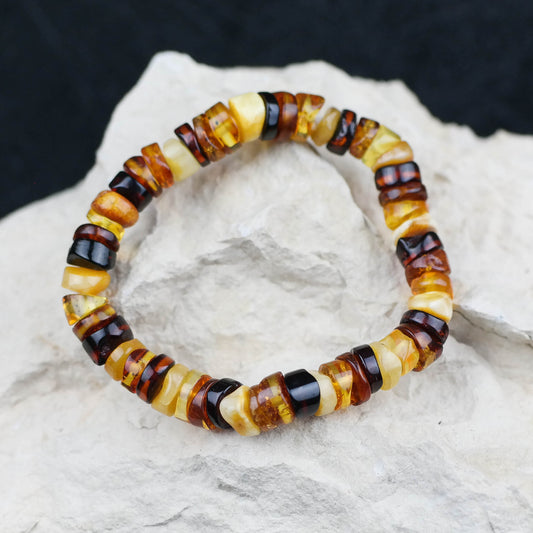 Colourful bracelet from tube shaped amber beads