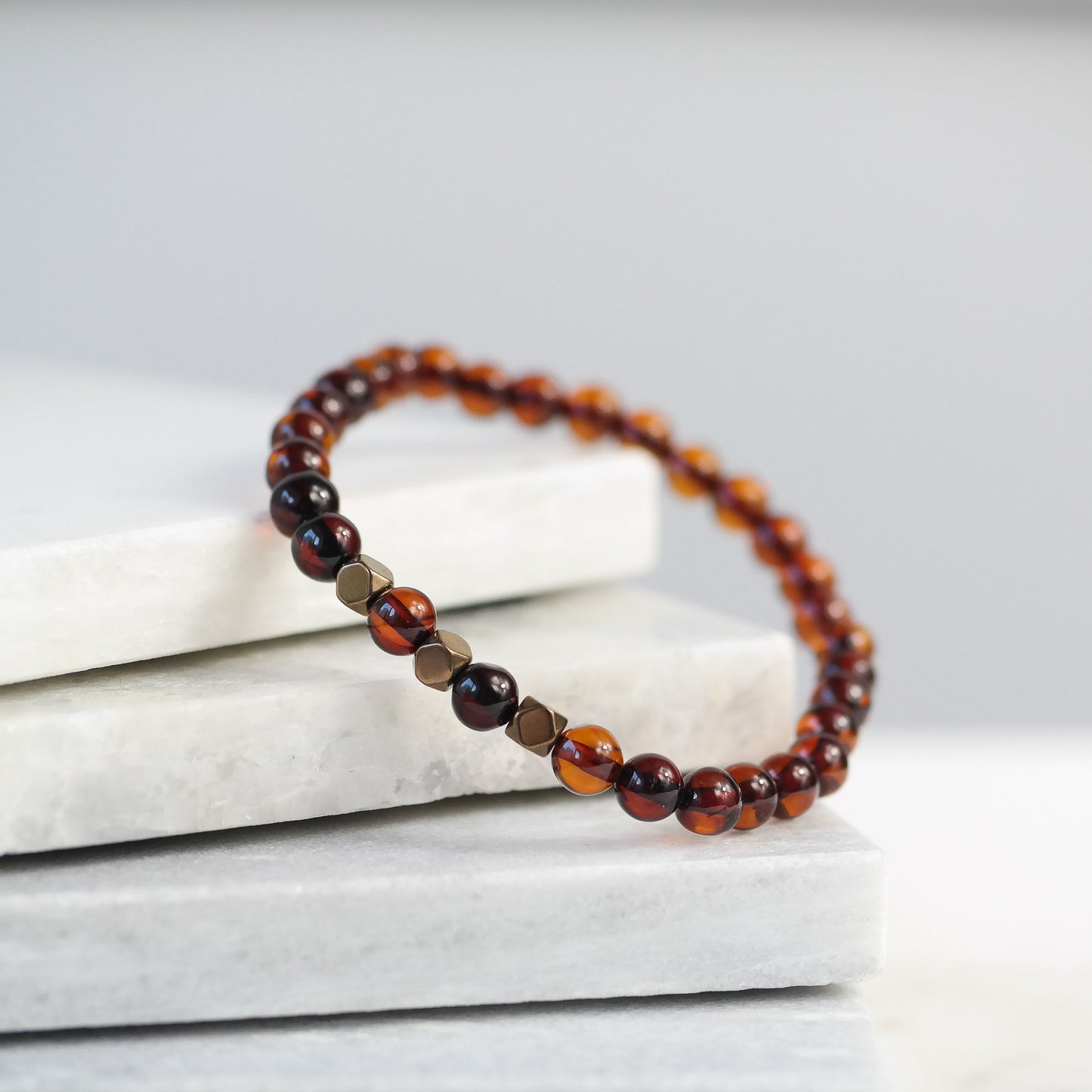 Chic natural Baltic amber bracelet with metal details