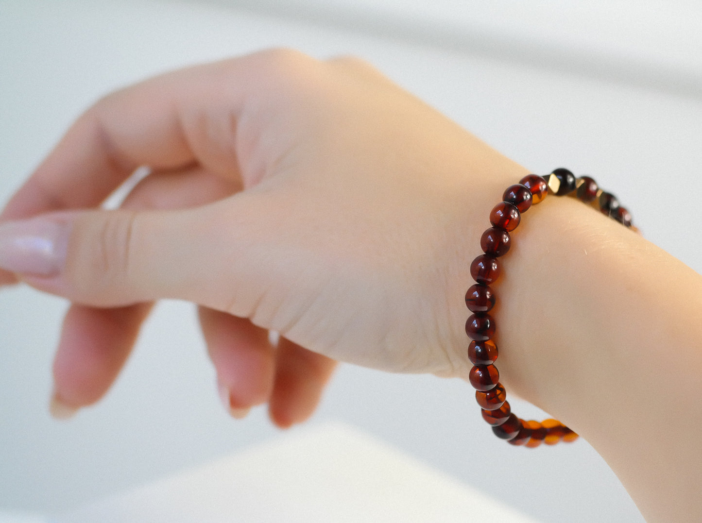 Chic natural Baltic amber bracelet with metal details