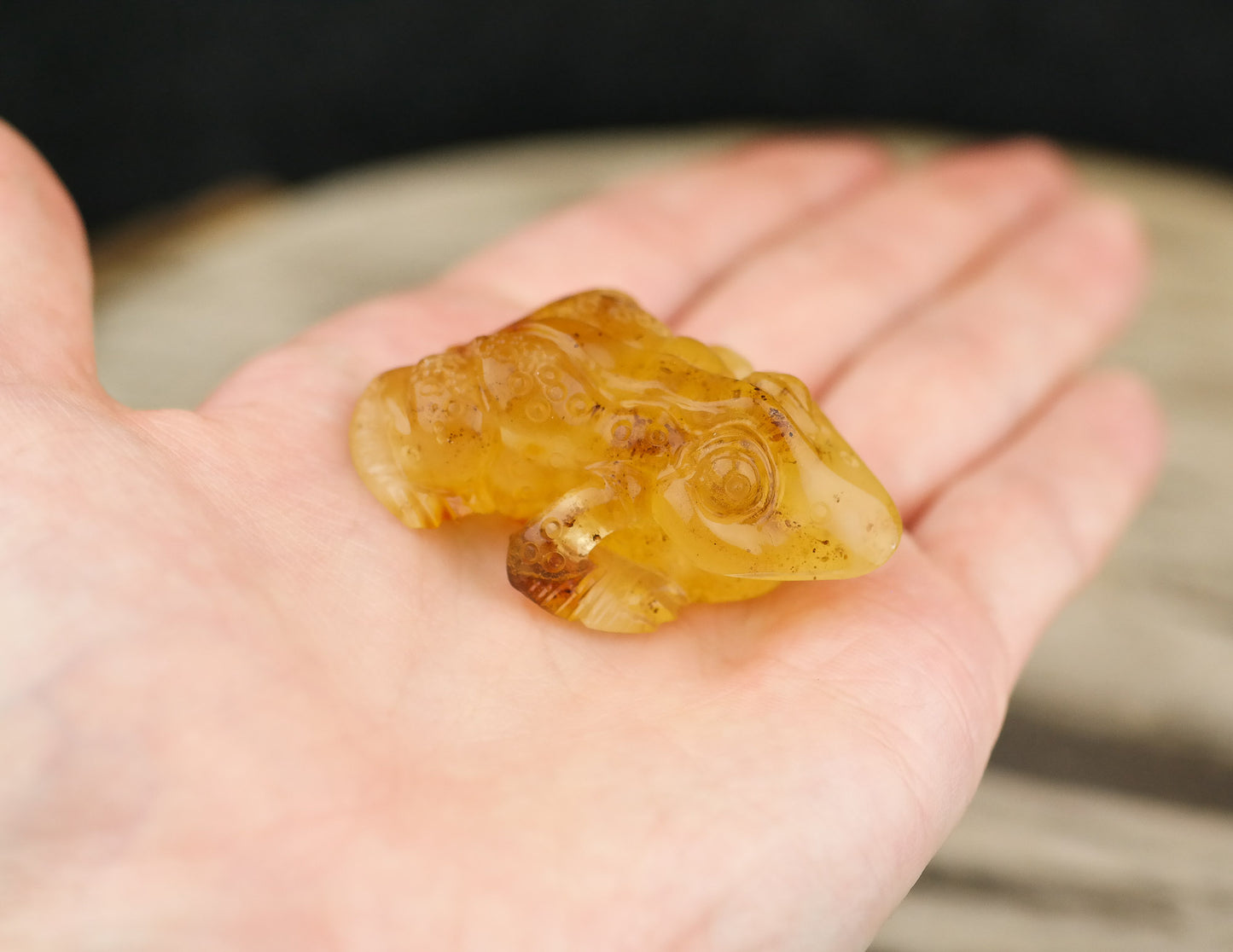 Hand carved frog figurine from natural Baltic amber