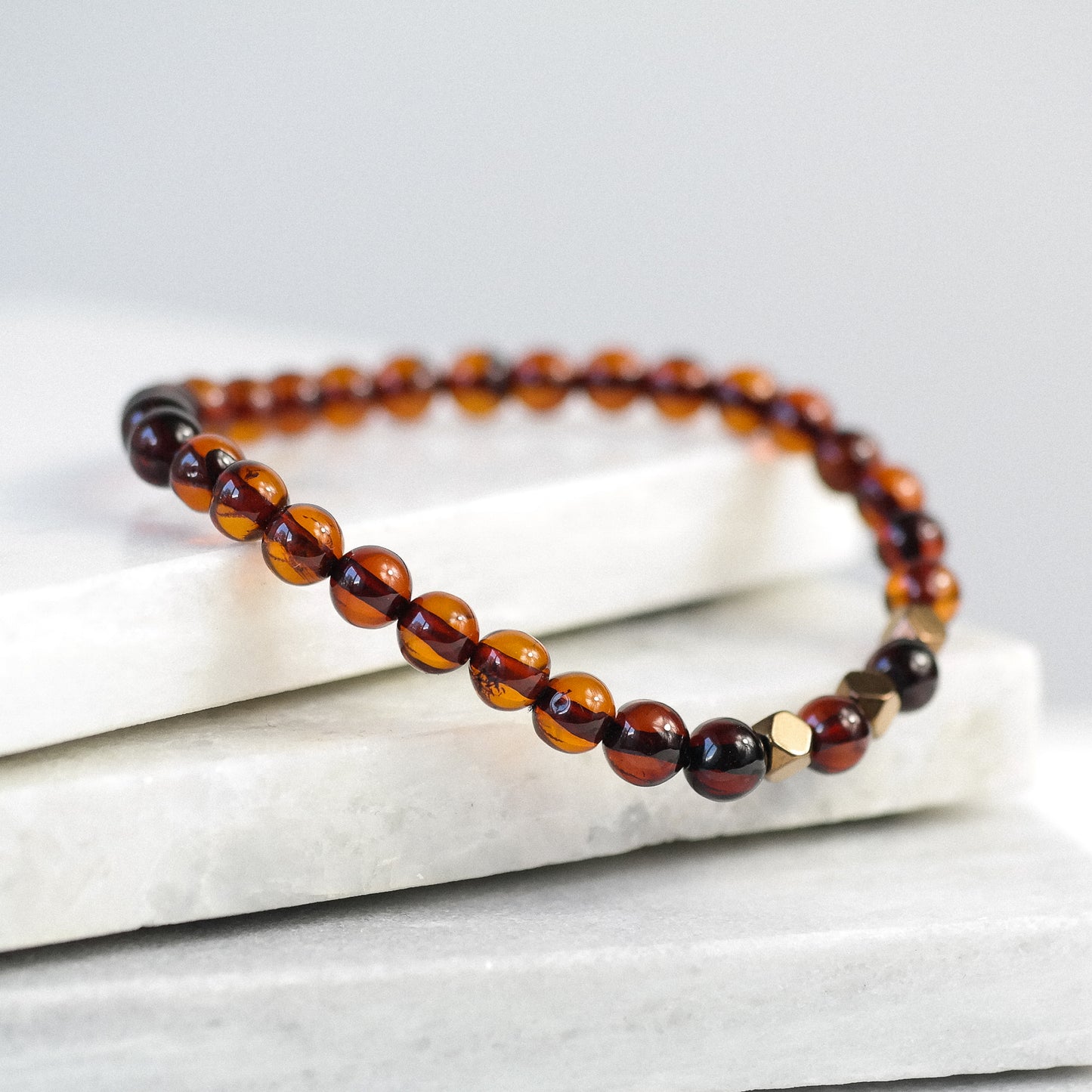 Chic natural Baltic amber bracelet with metal details