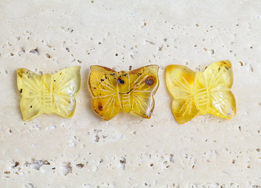 Hand carved butterfly figurines from natural Baltic amber