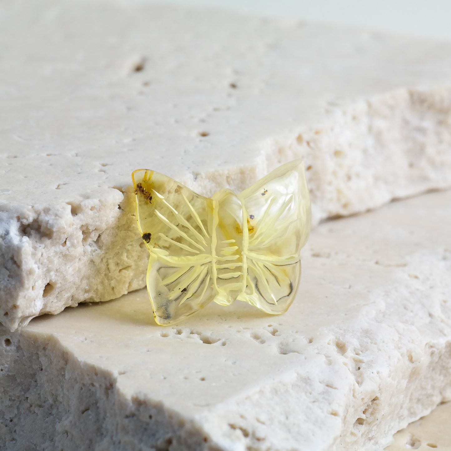 Hand carved butterfly figurines from natural Baltic amber