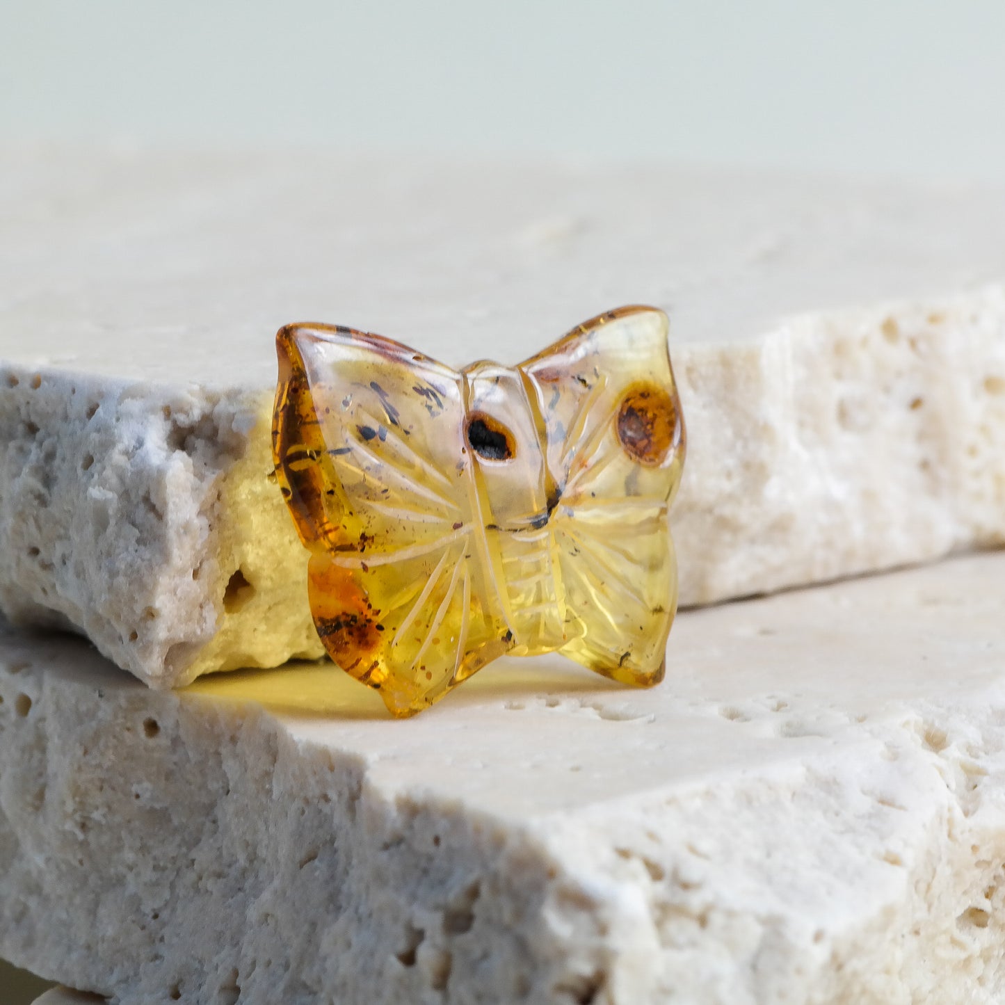 Hand carved butterfly figurines from natural Baltic amber