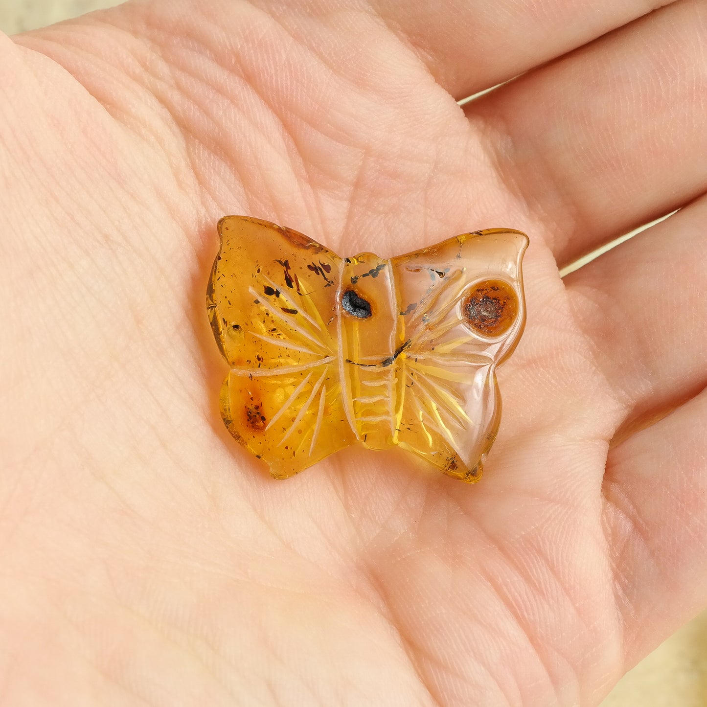 Hand carved butterfly figurines from natural Baltic amber