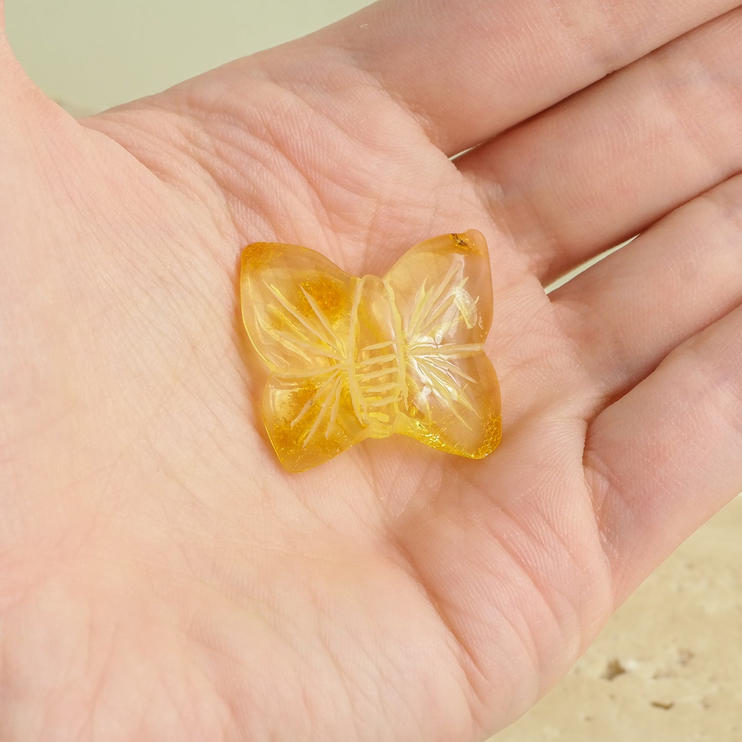 Hand carved butterfly figurines from natural Baltic amber