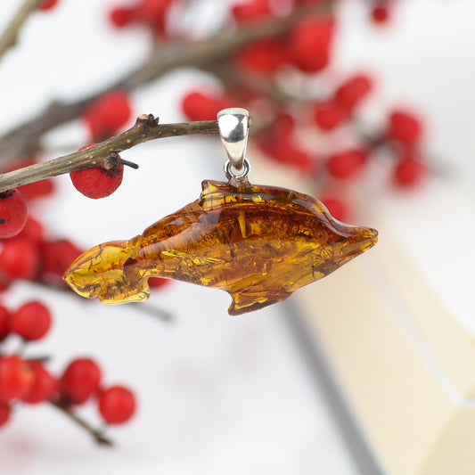 Dolphin pendant made of natural Baltic amber stone