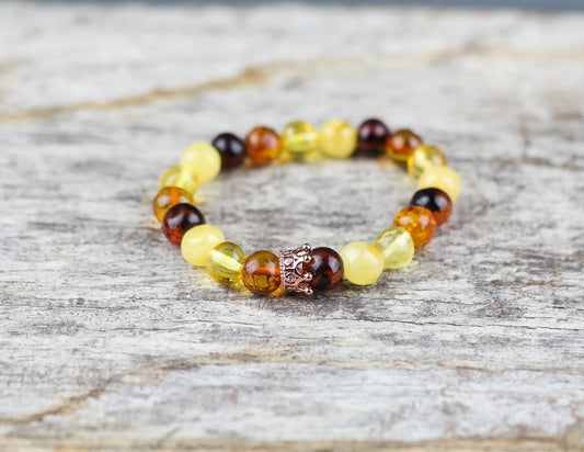 Amber bracelet with rose gold colour crown