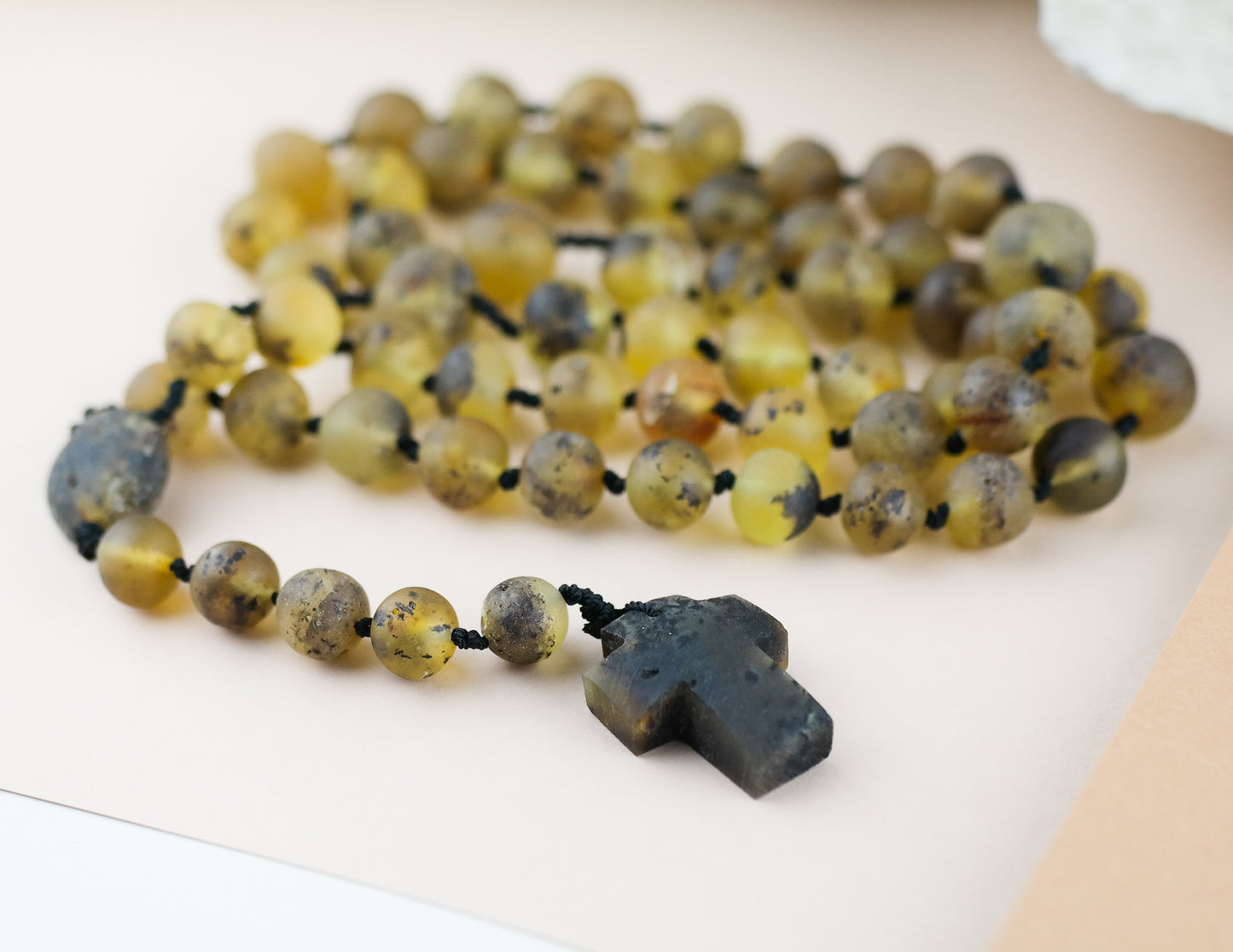 Baltic amber rosary made of green, baroque shaped amber beads