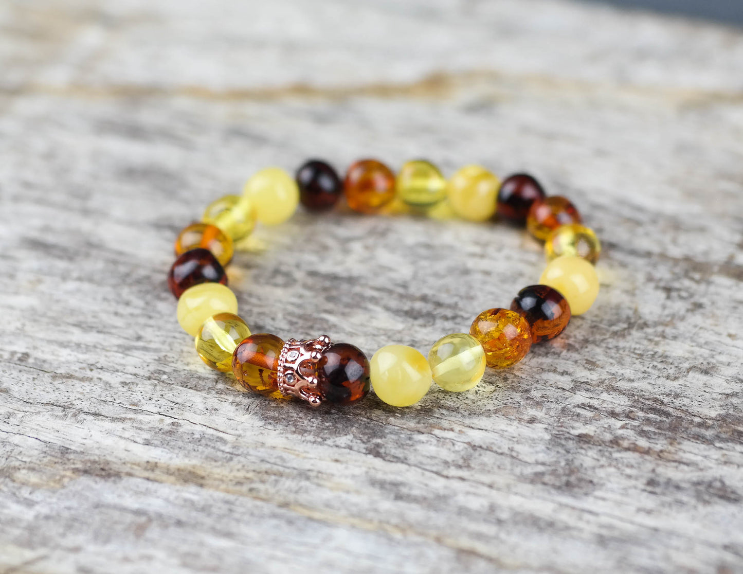 Amber bracelet with rose gold colour crown