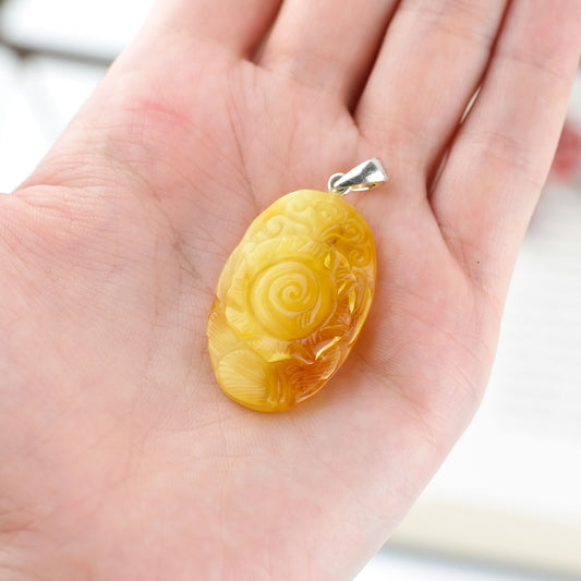 Natural amber hand carved rose pendant