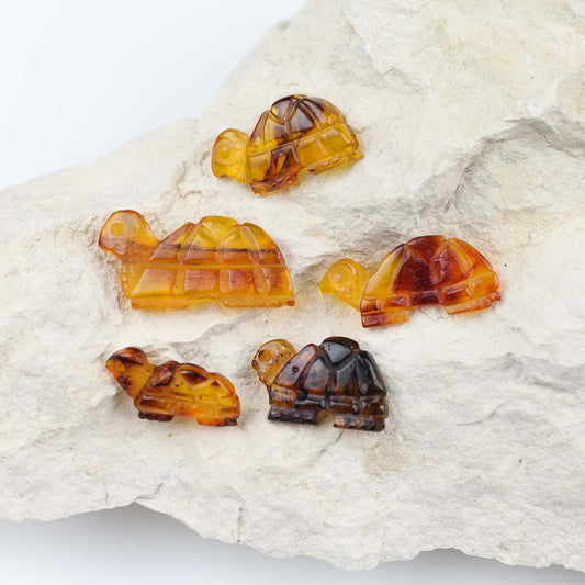 Small turtle figurines from natural Baltic amber