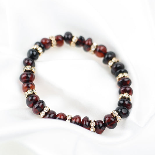 Cherry amber bracelets with gold colour spacers