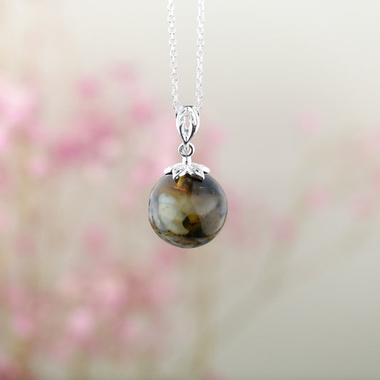 Silver pendant with natural Baltic amber bead