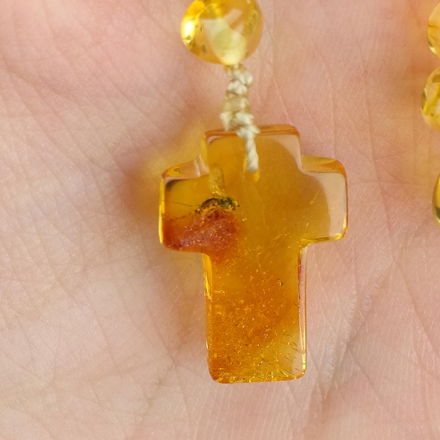 Unique natural Baltic amber rosary with little insect inside the cross