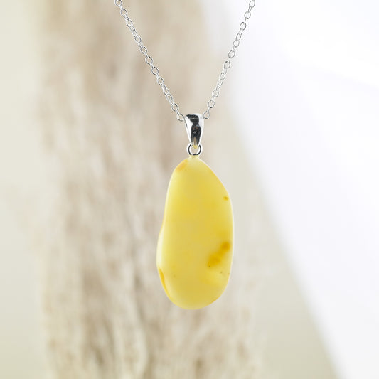 Handmade pendant from butterscotch amber