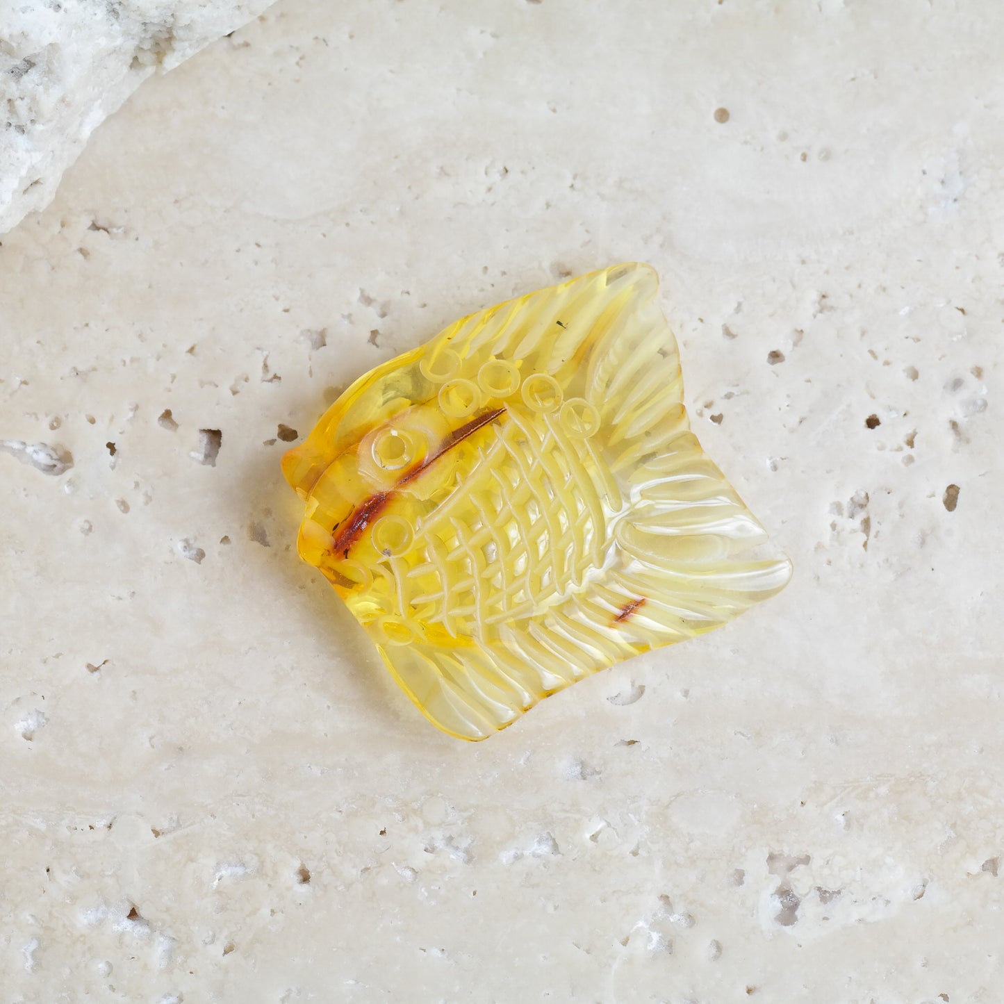 Hand carved fish figurine from natural Baltic amber