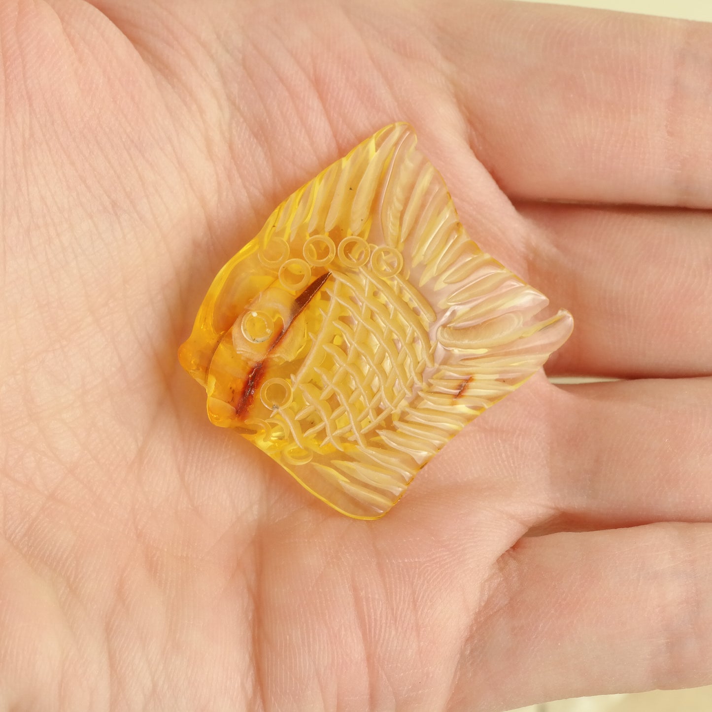 Hand carved fish figurine from natural Baltic amber