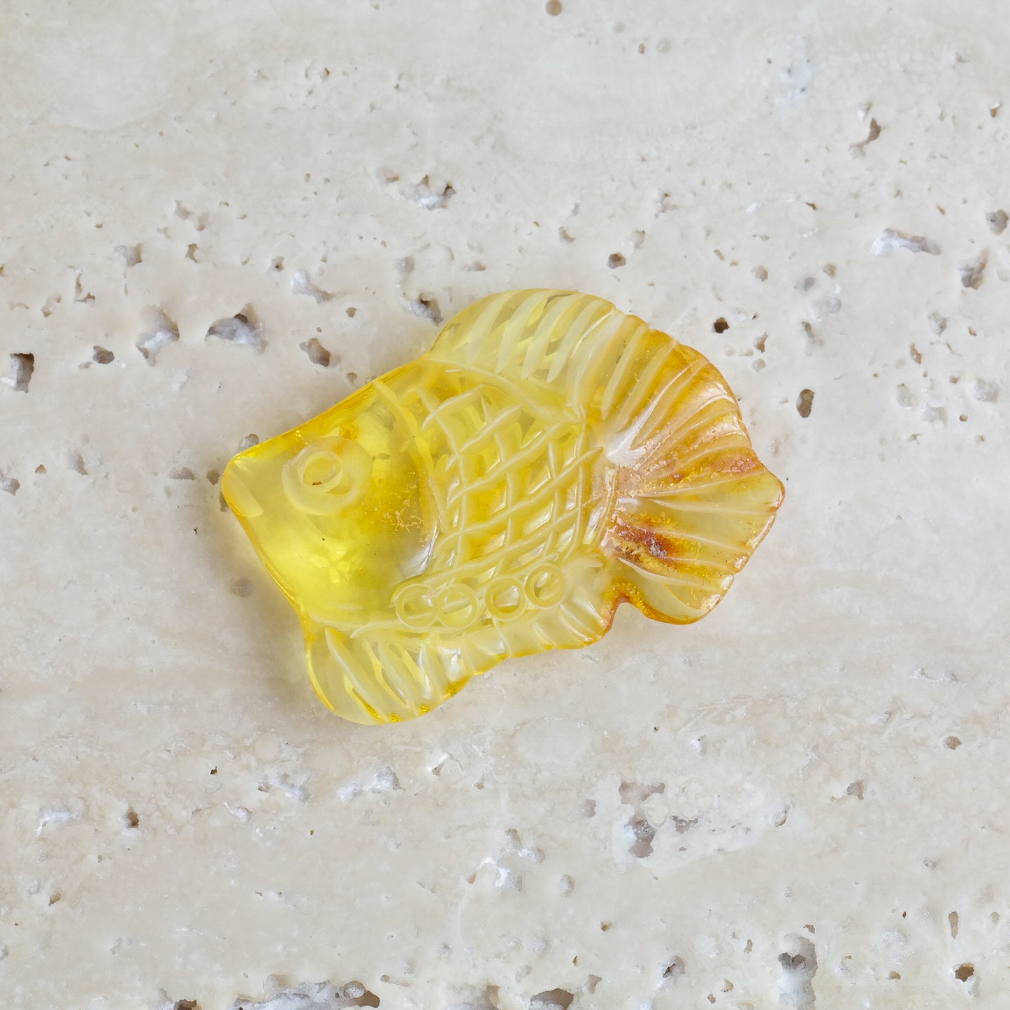 Hand carved fish figurine from natural Baltic amber