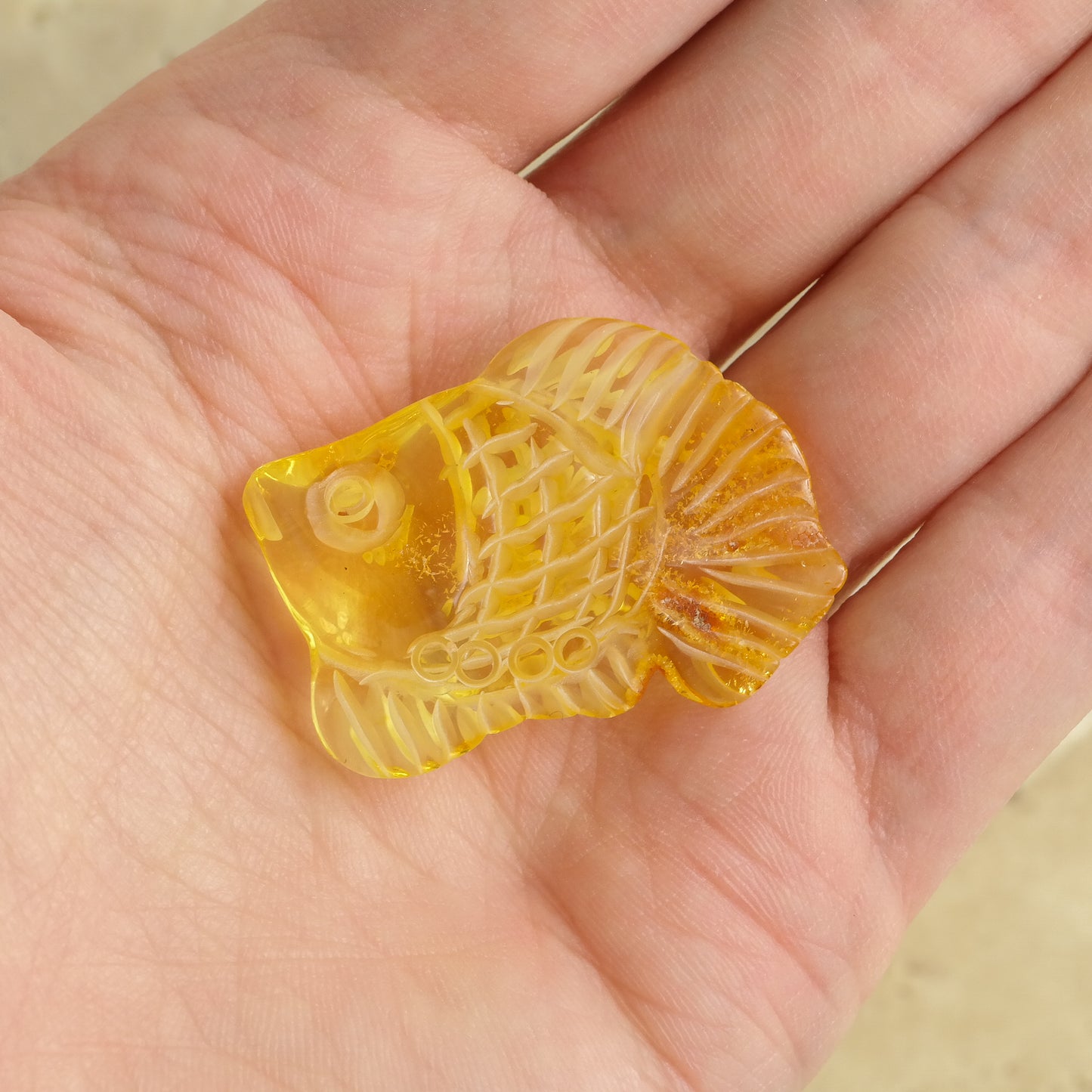 Hand carved fish figurine from natural Baltic amber