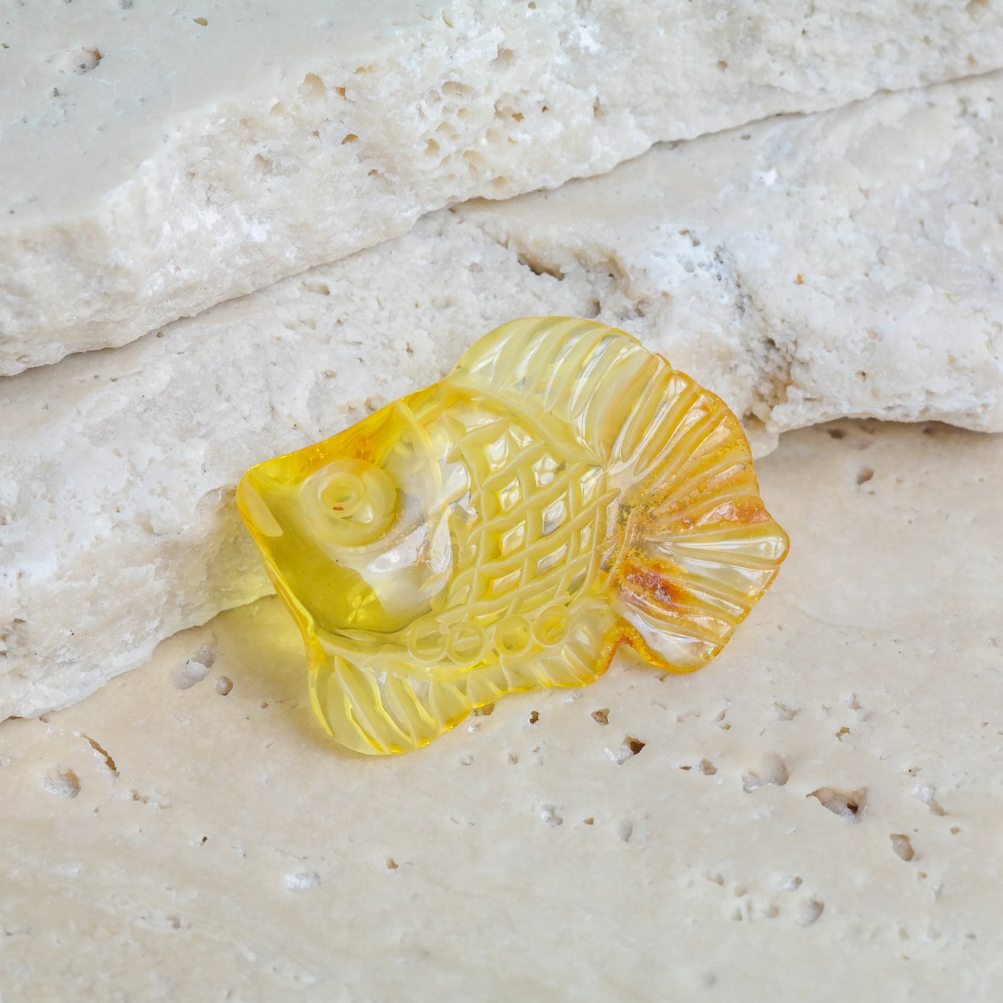 Hand carved fish figurine from natural Baltic amber