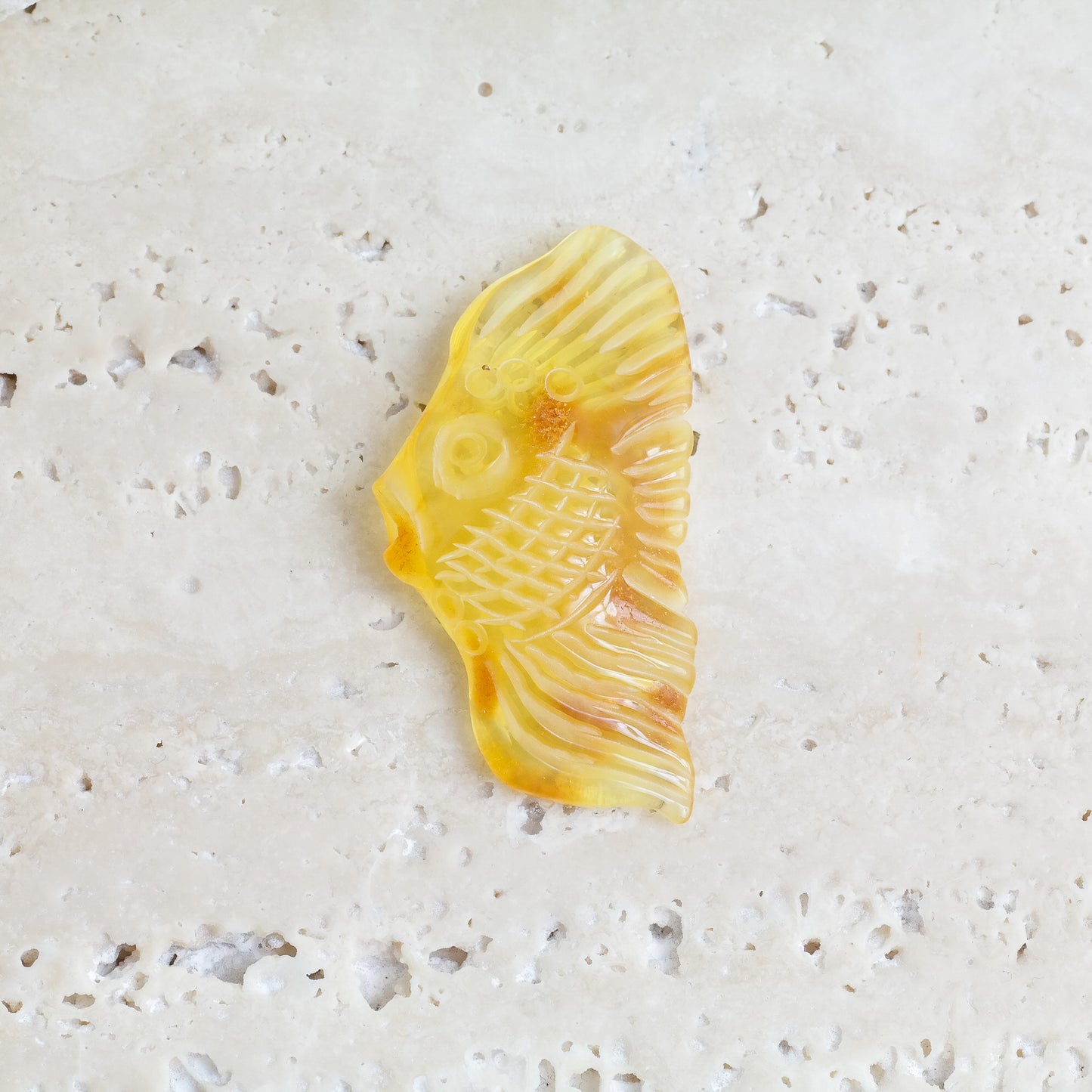 Hand carved fish figurine from natural Baltic amber