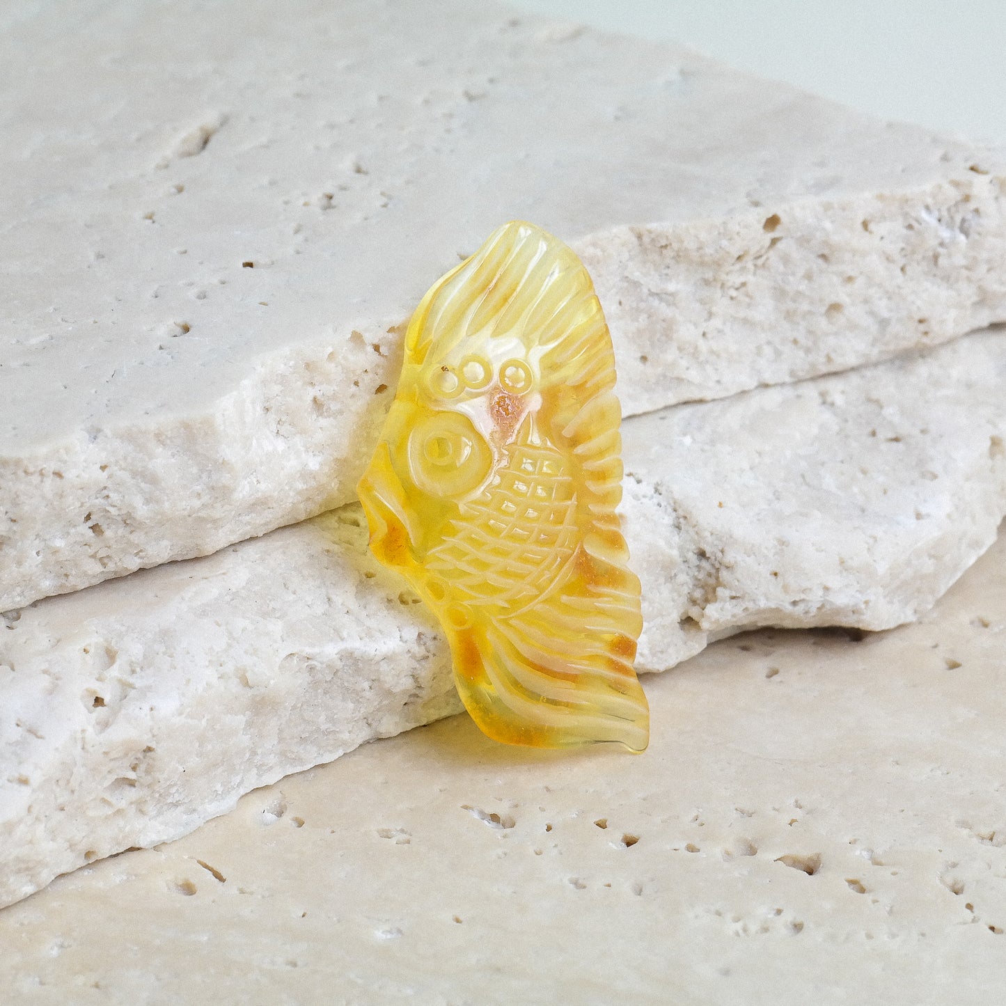 Hand carved fish figurine from natural Baltic amber